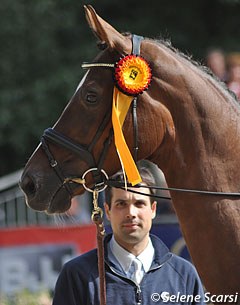 Helen's husband Sebastian Heinze holding Damon's Delorange