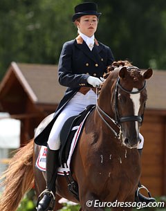 Norwegian Alexandra Andresen on the Hanoverian Belamour (by Belissimo M)