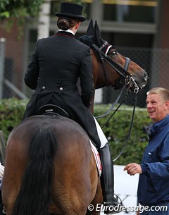 Swiss team coach Michael Deters talks to Anthea Hartmann after her ride on Rubinario