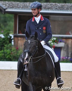 Carl Hester finishes his ride on Uthopia