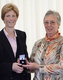 Laura Fry receiving the Medal of Honour from Jennie Loriston-Clarke at the 2012 British Dressage Championships