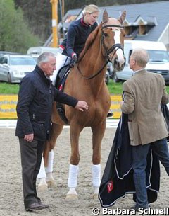 Laura and Mistral with her team: coach Klaus Balkenhol and home coach and father Wilfried