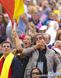 As Spanish flag bearer Alexandra Barbançon cheers for her sister Morgan