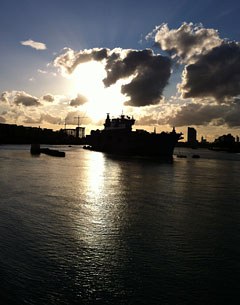 The Royal Navy's largest warship HMS OCean has sailed up the Thames as the military stepped up security preparations for the Olympics. The ship acts as a launch pad for eight Lynx helicopters and a base for Royal Marine snipers.