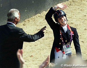 Charlotte Dujardin gets a pat on the back from judge Stephen Clarke