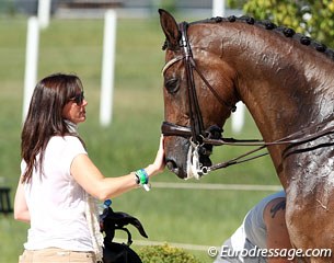 Lyndal Oatley patting her horse Toy Story (by Come Back II)