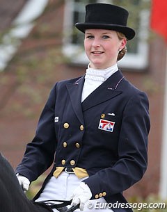 The logo of the Dutch Olympic Horse Foundation stitched on Coby van Baalen's 2000 Olympic tails, now worn by her student Dutch Young Rider Debora Pijpers :: Photo © Astrid Appels