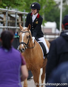 Erin Williams walks through the crowds with Dynasty after finishing a winning test