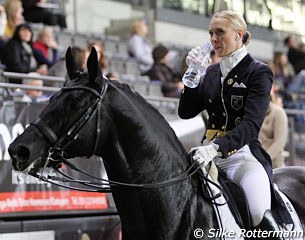 Terhi Stegars sipping from a drink before entering the competition ring