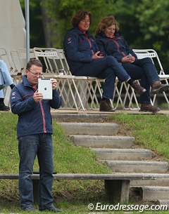 Alex Hardwick's dad videoing his daughter's ride with the iPad while the British chef d'equipe is watching as well
