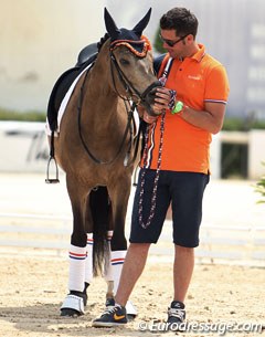 Champ of Class is cuddling with his handler during the award ceremony