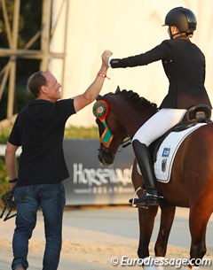 Hannah Cichos and her dad high five