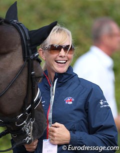 American WEG team rider Katherine Bateson-Chandler cuddling with Valegro