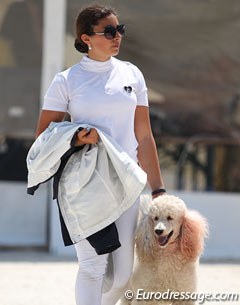 Salome Sadoun and her poodle, whose ears were dyed blue and red to represent the French flag