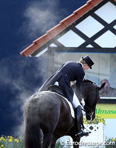 One of my favourite photos of the show: Nathalie zu Sayn-Wittgenstein pats Fabienne at the end of her ride. Morning freezing temperatures show the steam coming off Fabienne