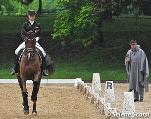 Vici and Blind Date preparing for the test in the rain. Coach Wolfram Wittig is well covered up