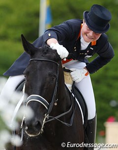 Mara de Vries is visibly pleased with her ride on Ojay and gives him a big pat and rub 