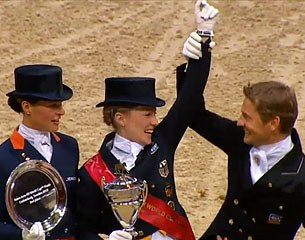 Edward Gal lifts Helen's arm in the air