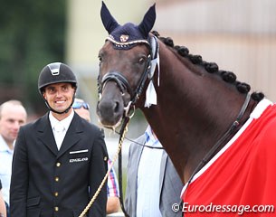 Andreas Helgstrand looks at his silver medal winning Floricello