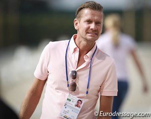 Minderhoud's partner Edward Gal checking out the score board