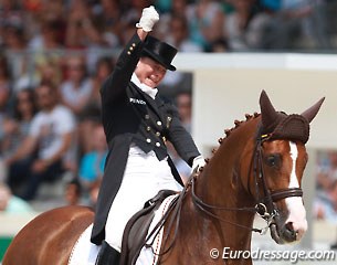 Isabell Werth cheers after her Kur on Bella Rose