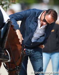 Porsche's trainer Dieter Laugks patting Florencia