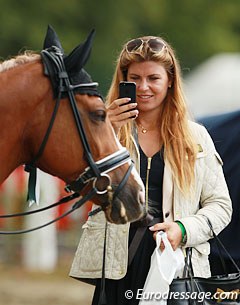 Swedish trainer Elin Aspnas takes a photo of her student Jennifer Lindvall's Hynder Hoeve's Ramses