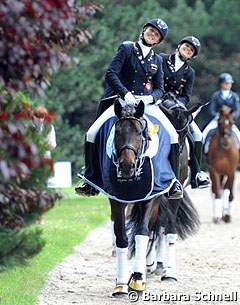 German juniors Jessica Krieg and Anna Christina Abbelen smiling to the camera after the prize giving at the 2014 CDIO-PJYR Hagen :: Photo © Barbara Schnell