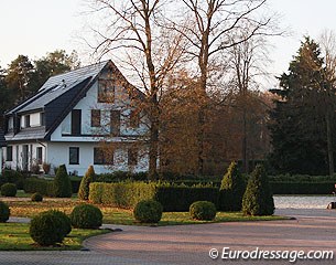 The main house and part of the outdoor arena