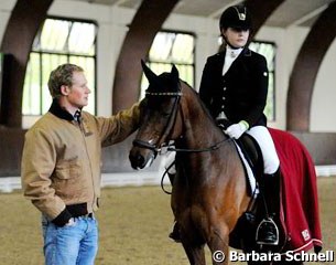 Step brother Matthias Rath patting Marie Linsenhoff's Lord Champion