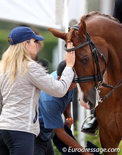 Trainer Ashley Holzer pats Jewel's Adelante