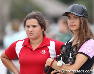 Tanya Strasser-Shostak and a friend holding the cutest French bulldog pup are watching the jog