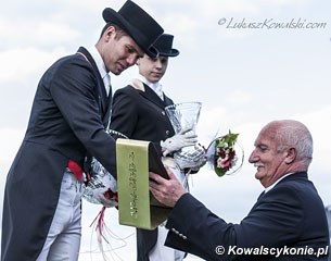 Polish Under 25 rider Mateusz Cichon was honoured for being Poland's best performing Young Rider in 2013. He receives an award from Polish judge Waclaw Pruchniewicz