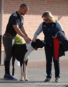 Begijnhoeve owner Rob van Puijenbroek and U.S. Dressage Director Jenny van Wieren patting Rob's Danish dog