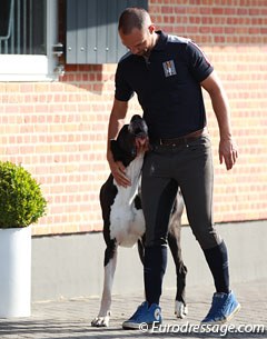 Rob gives his dog big cuddles