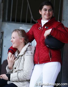 Pony friends hang out near the stables and watch the class