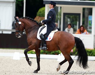 Arnaud Serre and Robinson De La Font. The horse got deep and hectic in the trot extensions and overzealous in passage, but the piaffe was excellent. The rider's reins kept getting longer and longer which didn't help the silhouette