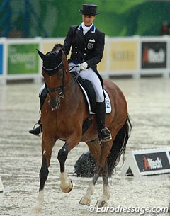 Eevamaria Porthan-Broddell on the 18-year old Solos Lacan in the pouring rain at the 2014 World Equestrian Games :: Photo © Astrid Appels