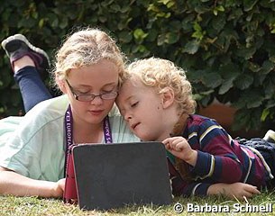 Fiona Bigwood's kids keep themselves entertained ringside