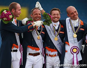 The Dutch gold medalists having fun on the podium. Van Silfhout pushes his flowers in Gal's face