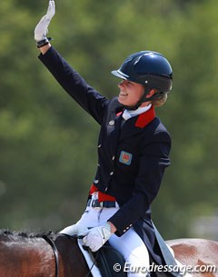 Charlotte Fry waves to her supporters