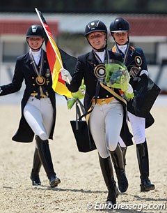 The kur medalists in their lap of honour