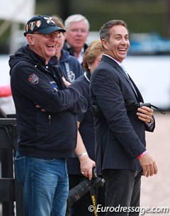 Rosamunde's former owner Jochen Arl and U.S. team coach Robert Dover cheer as Steffen Peters finishes his test