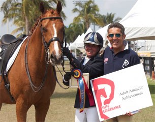 Ellen Lazarus and Rhett (left) are awarded the Piaffe Performance Adult Amateur Achievement Award, Presented by Dr. Cesar Parra of Piaffe Performance