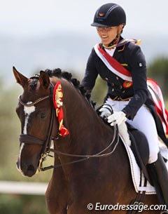 Hannah Erbe gives Carlos a big pat during the victory lap