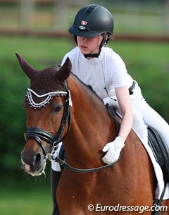 Swiss Renee Stadler hugging Dolce Vita, the pony who was first known in the international ring as Oualidaluna