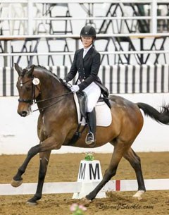 Taylor Rowsey and Poulidon claimed the blue ribbon in the FEI Intermediaire I despite dealing with major flooding at her Houston area farm just days before the competition. Photo by Susan J. Stickle
