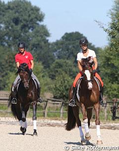 Open training day at Ingrid Klimke's yard. Ingrid on Geraldine, Franziskus getting warmed up in the back ground