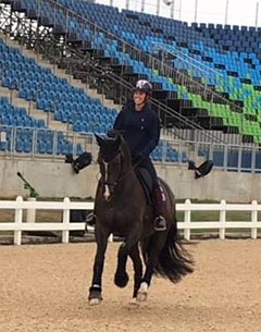 Charlotte Dujardin and Valegro in a snaffle taking a relaxed canter around the show ring