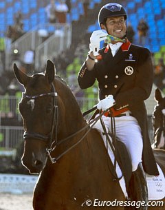 Carl Hester flashes his team silver to the fans